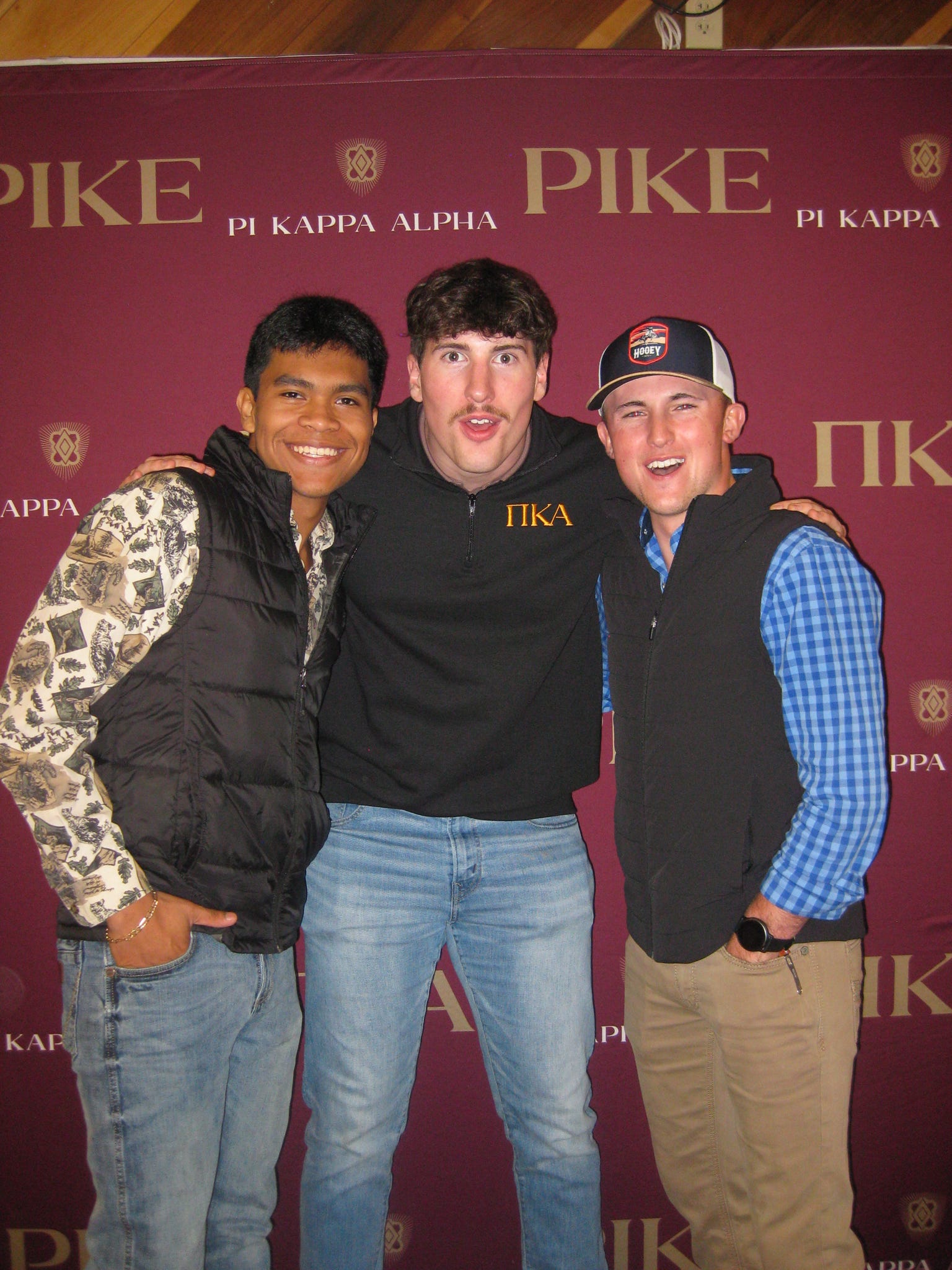 Three PIKE members at event